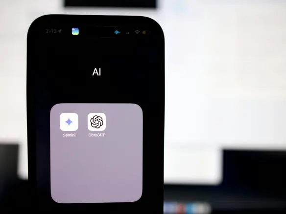 a close up of a cell phone with an ai button