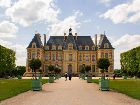 a large building with a lot of trees in front of it