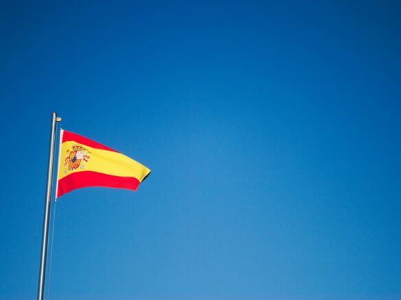 orange and yellow flag in pole