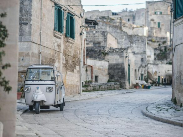 a small car parked on the side of a street