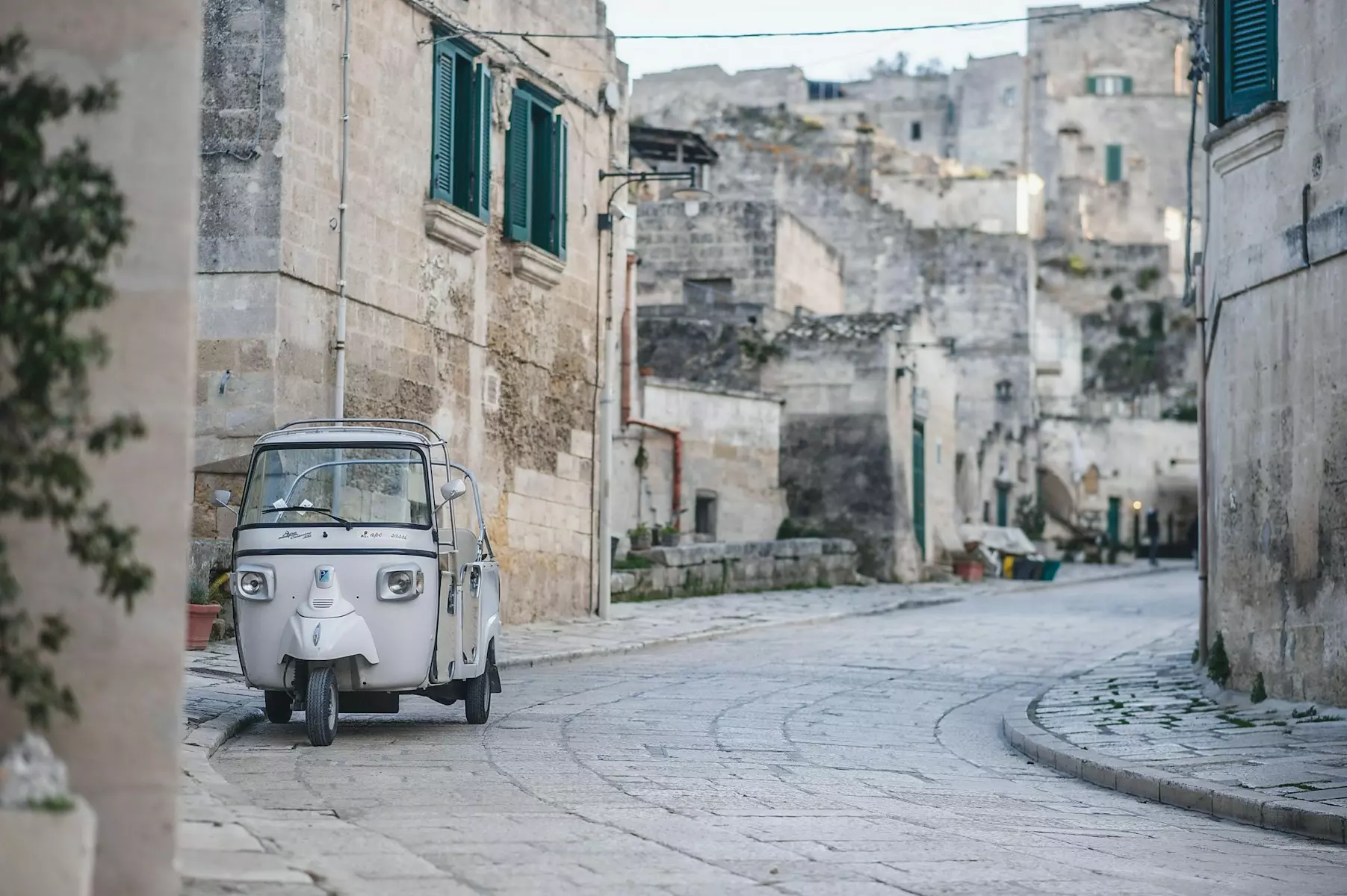 a small car parked on the side of a street