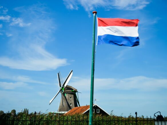 white and blue flag on pole during daytime