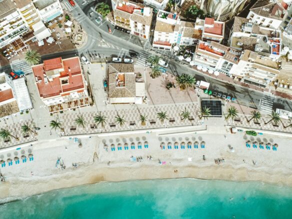 an aerial view of a beach and a city