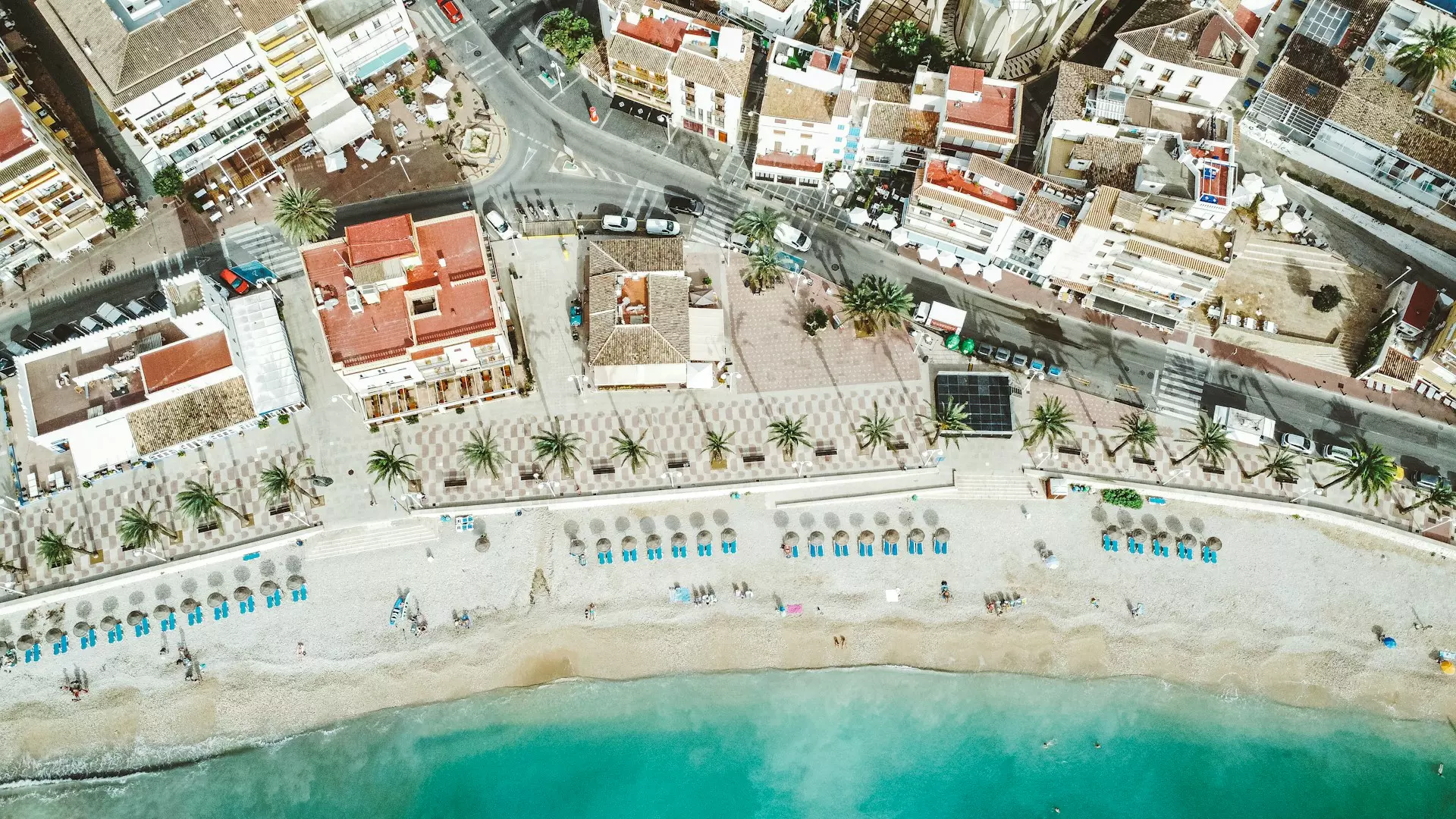 an aerial view of a beach and a city
