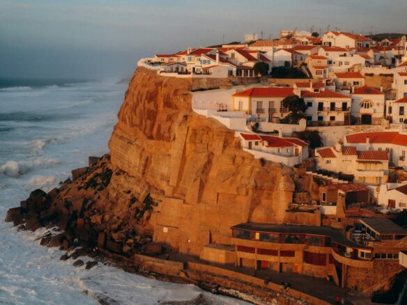 a town on a cliff overlooking the ocean
