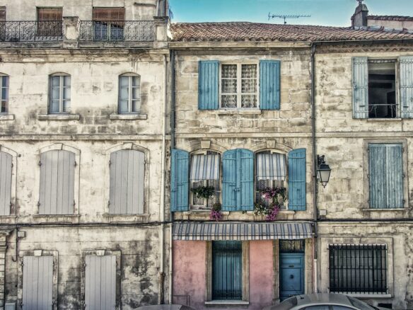 white, blue, and pink painted house