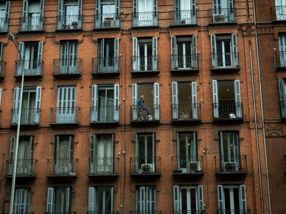 a tall building with lots of windows and balconies