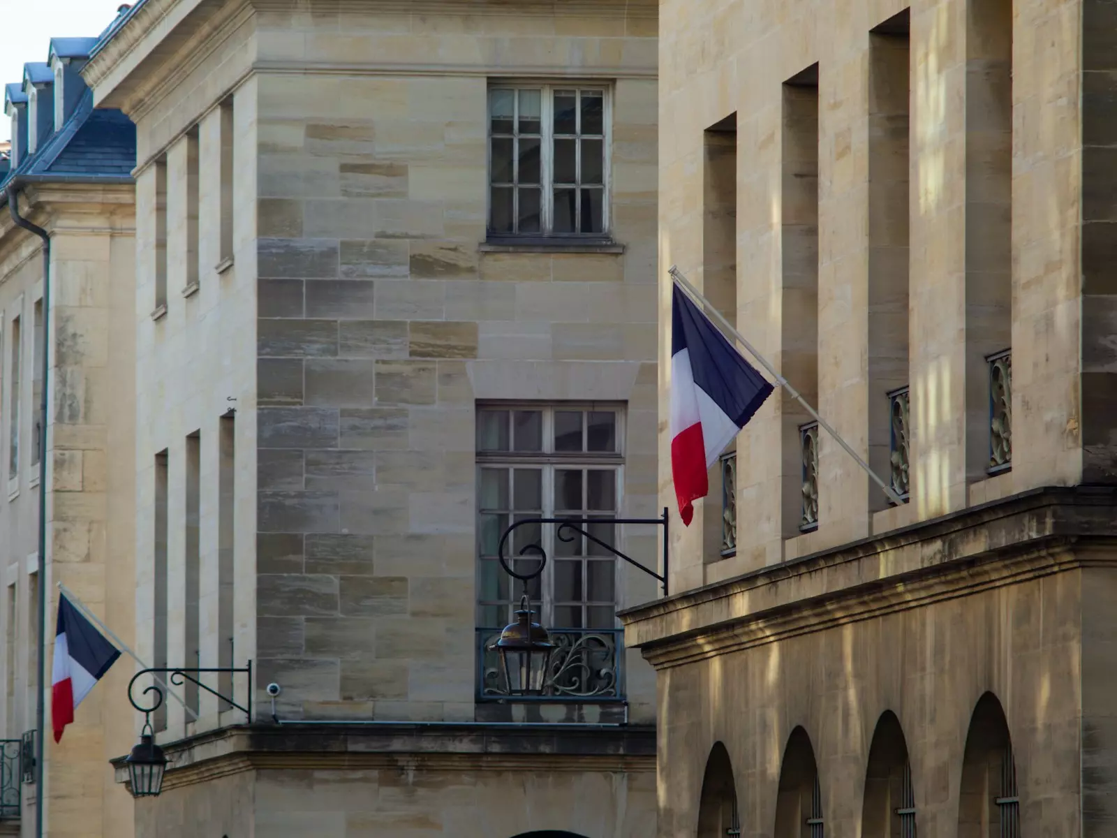 a building with two flags flying in front of it