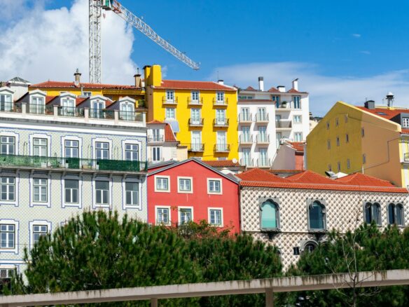 Colorful buildings stand against a blue sky.