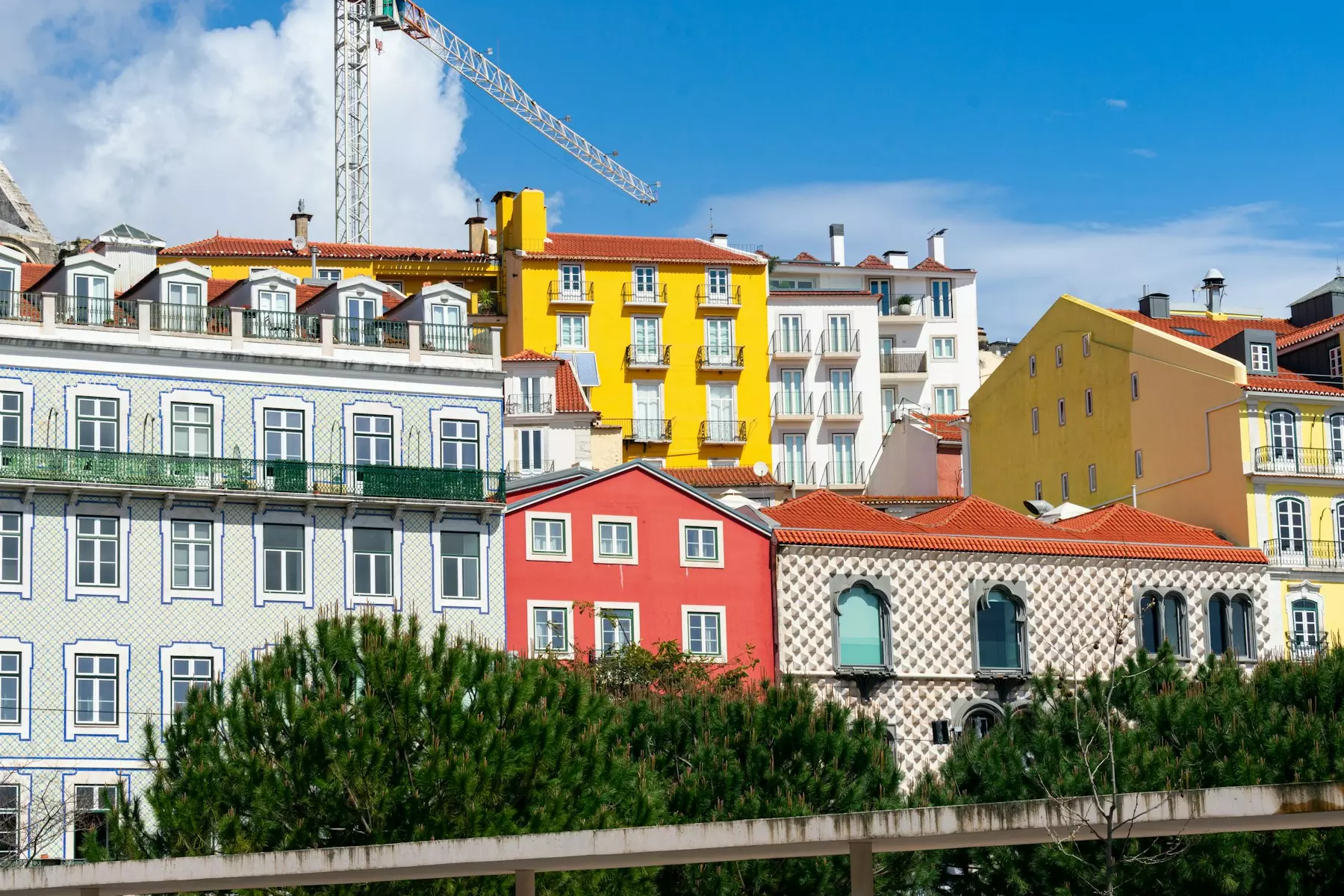 Colorful buildings stand against a blue sky.