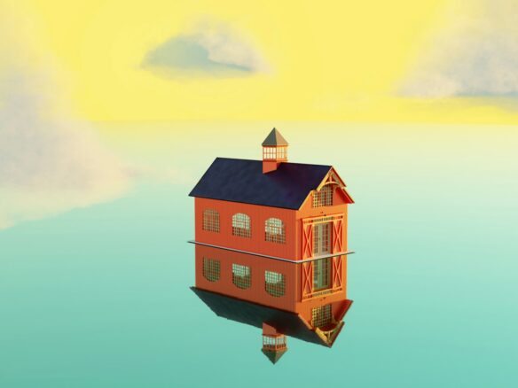 a house floating in the middle of a body of water