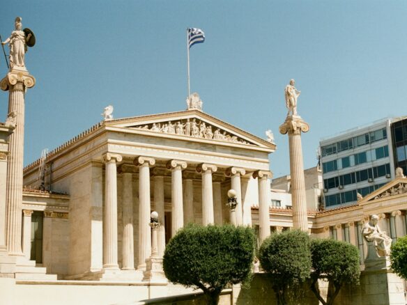 A building with columns and statues in front of it