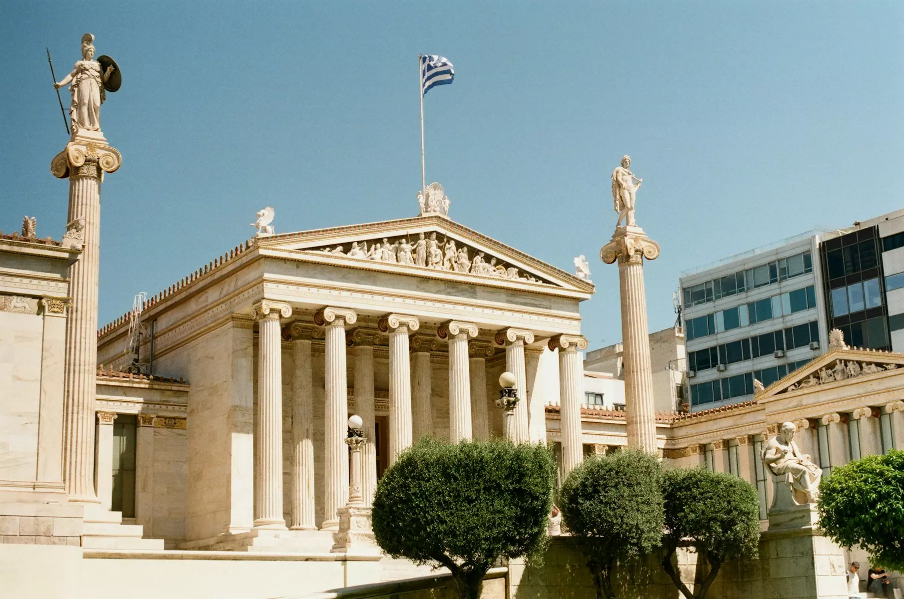 A building with columns and statues in front of it