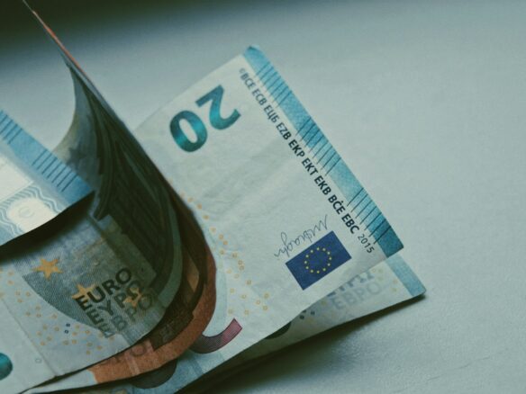 5 euro bill on white table