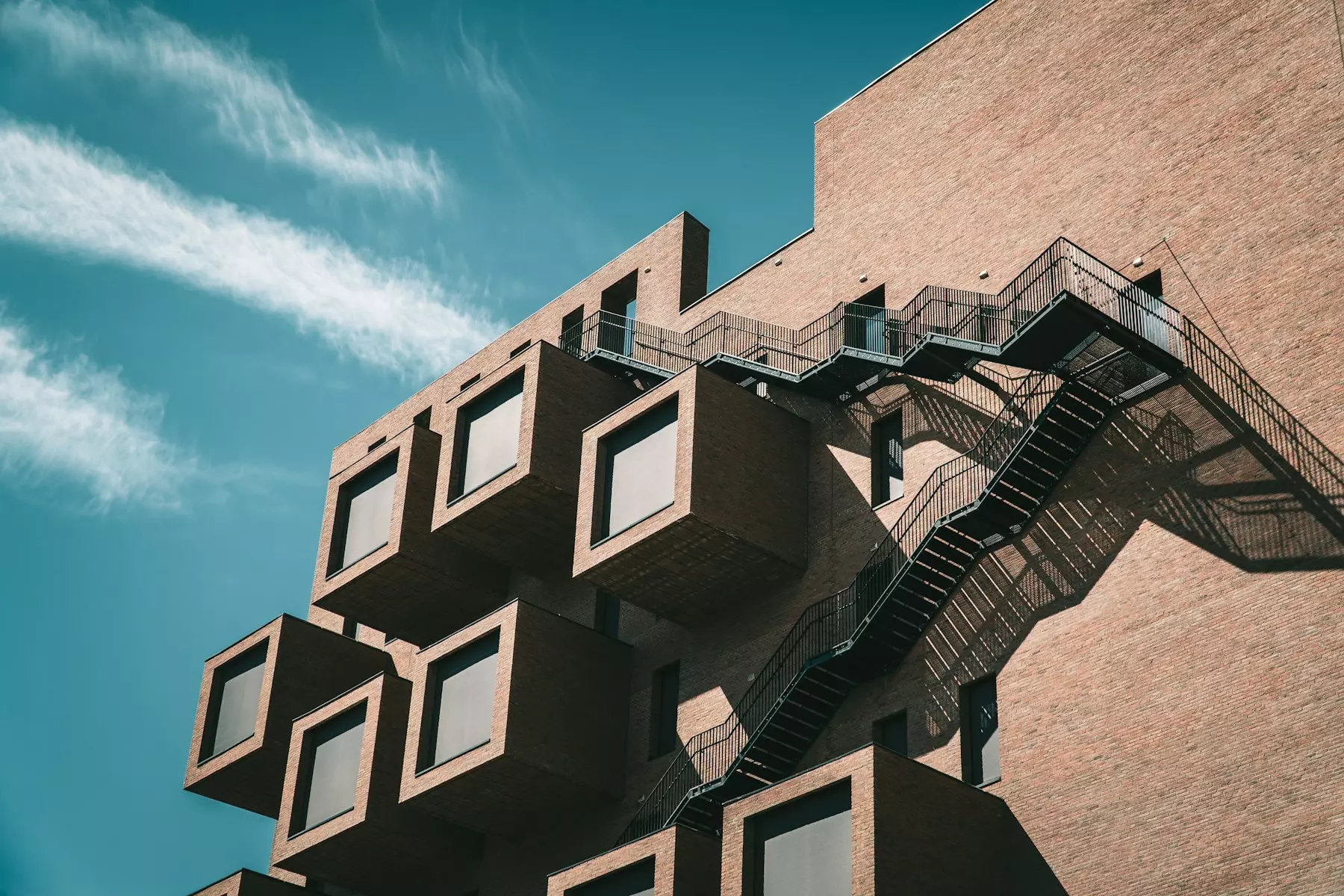 brown concrete building under blue sky during daytime