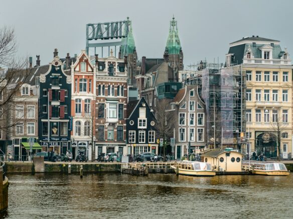 a river with a bunch of buildings in the background