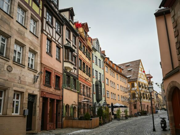 a cobblestone street lined with old buildings