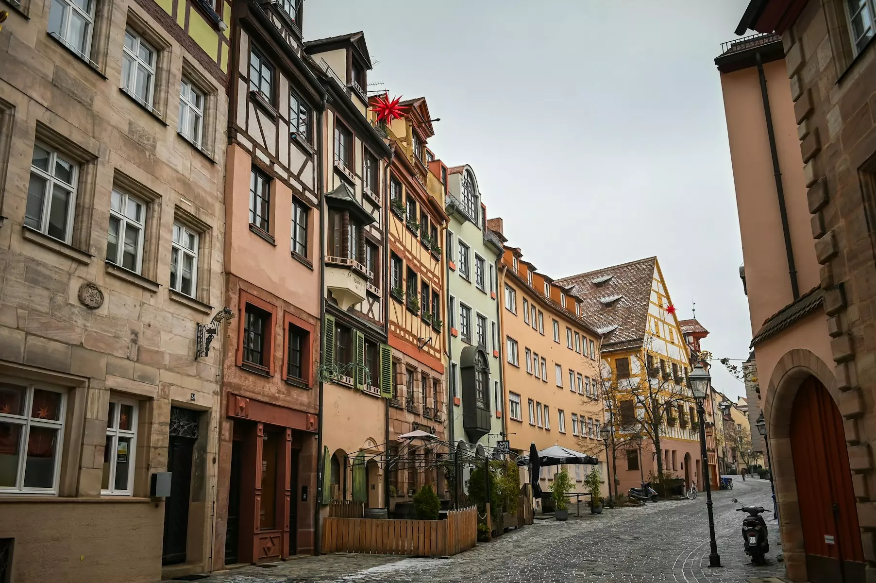 a cobblestone street lined with old buildings