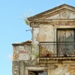 an old building with a balcony and balconies