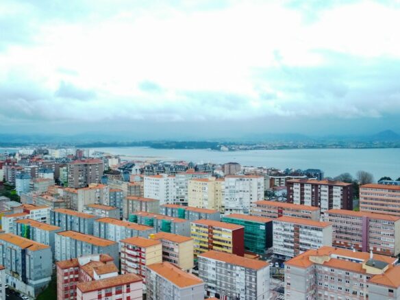 a view of a city with a body of water in the background