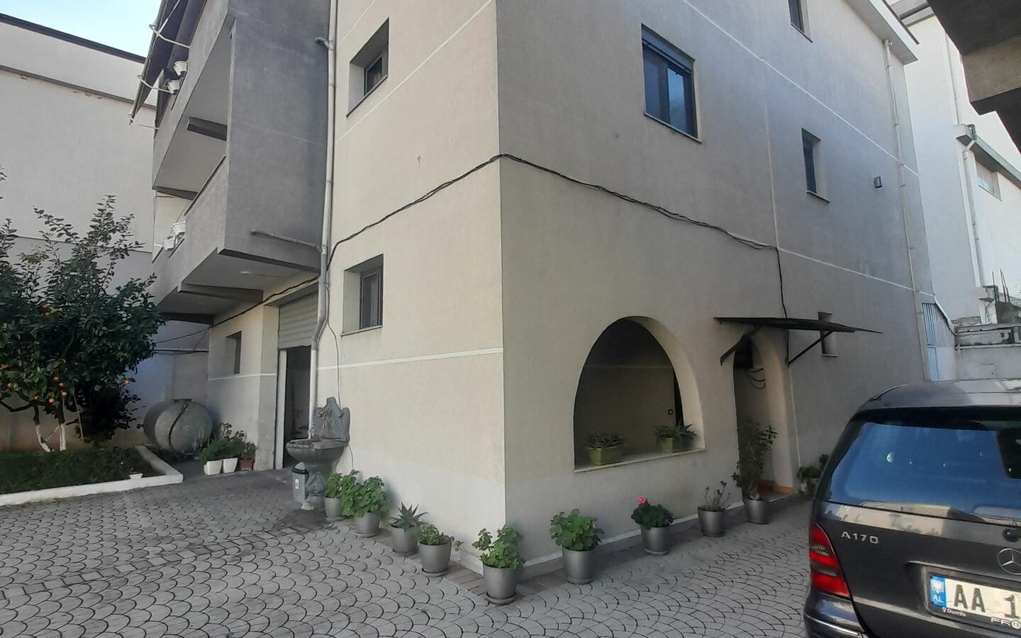 House Containing Three Apartments And A Garage