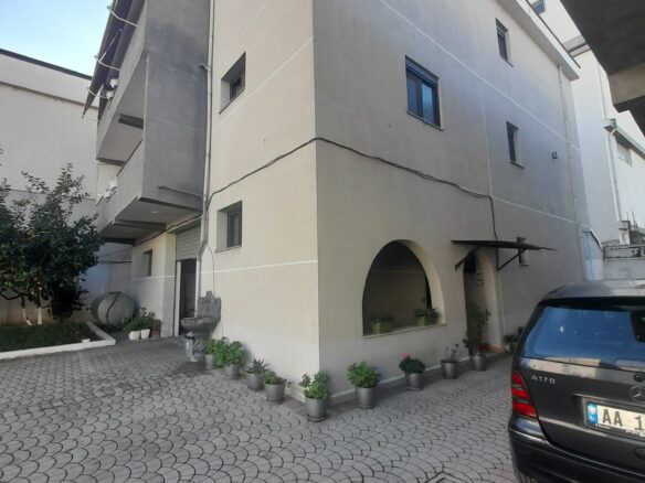 House Containing Three Apartments And A Garage