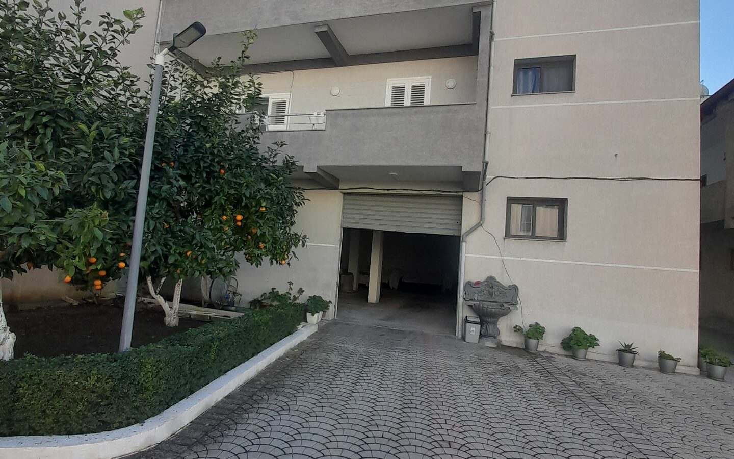 House Containing Three Apartments And A Garage