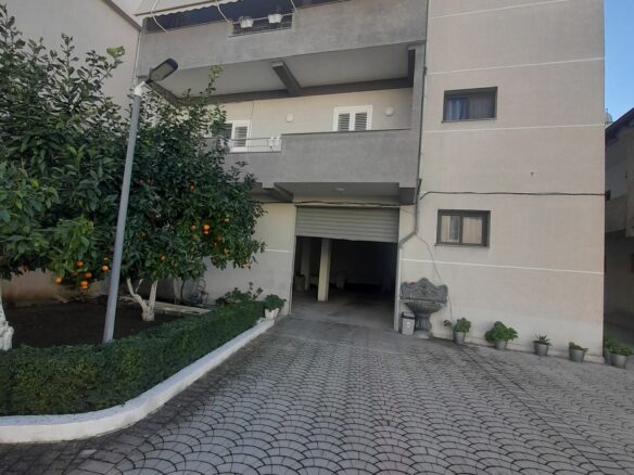 House Containing Three Apartments And A Garage