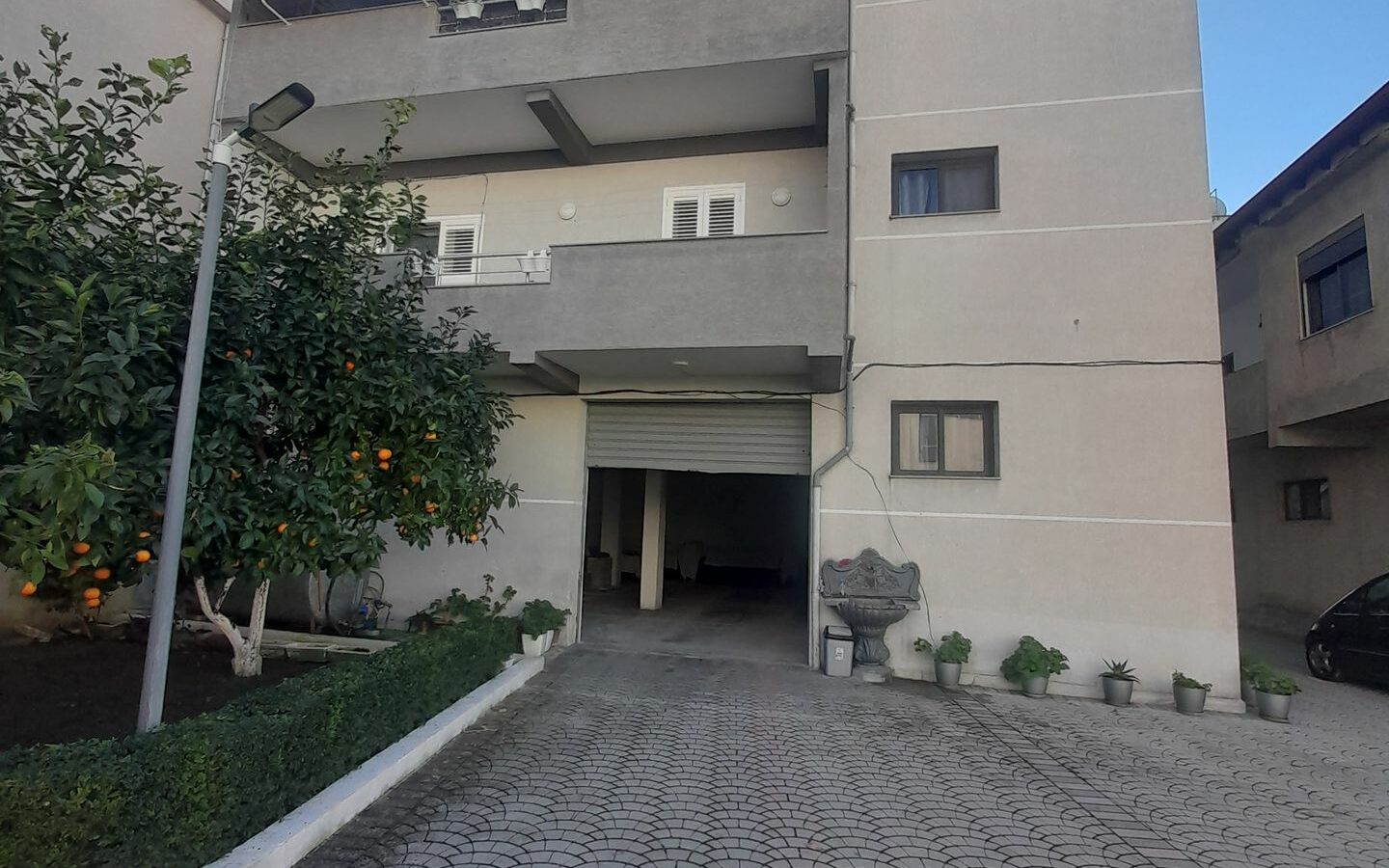 House Containing Three Apartments And A Garage