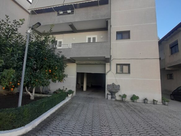 House Containing Three Apartments And A Garage
