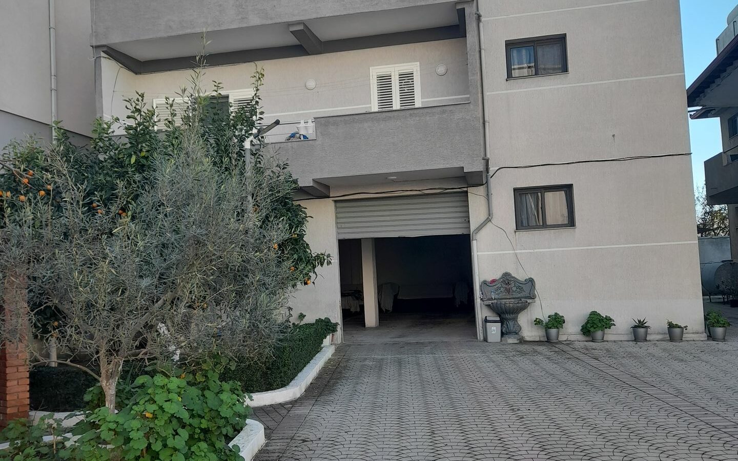 House Containing Three Apartments And A Garage