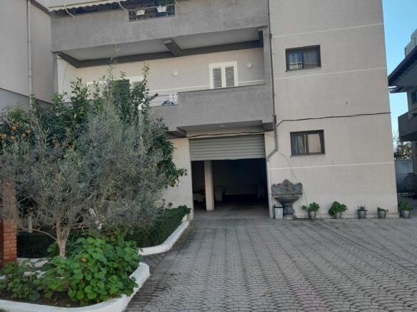 House Containing Three Apartments And A Garage
