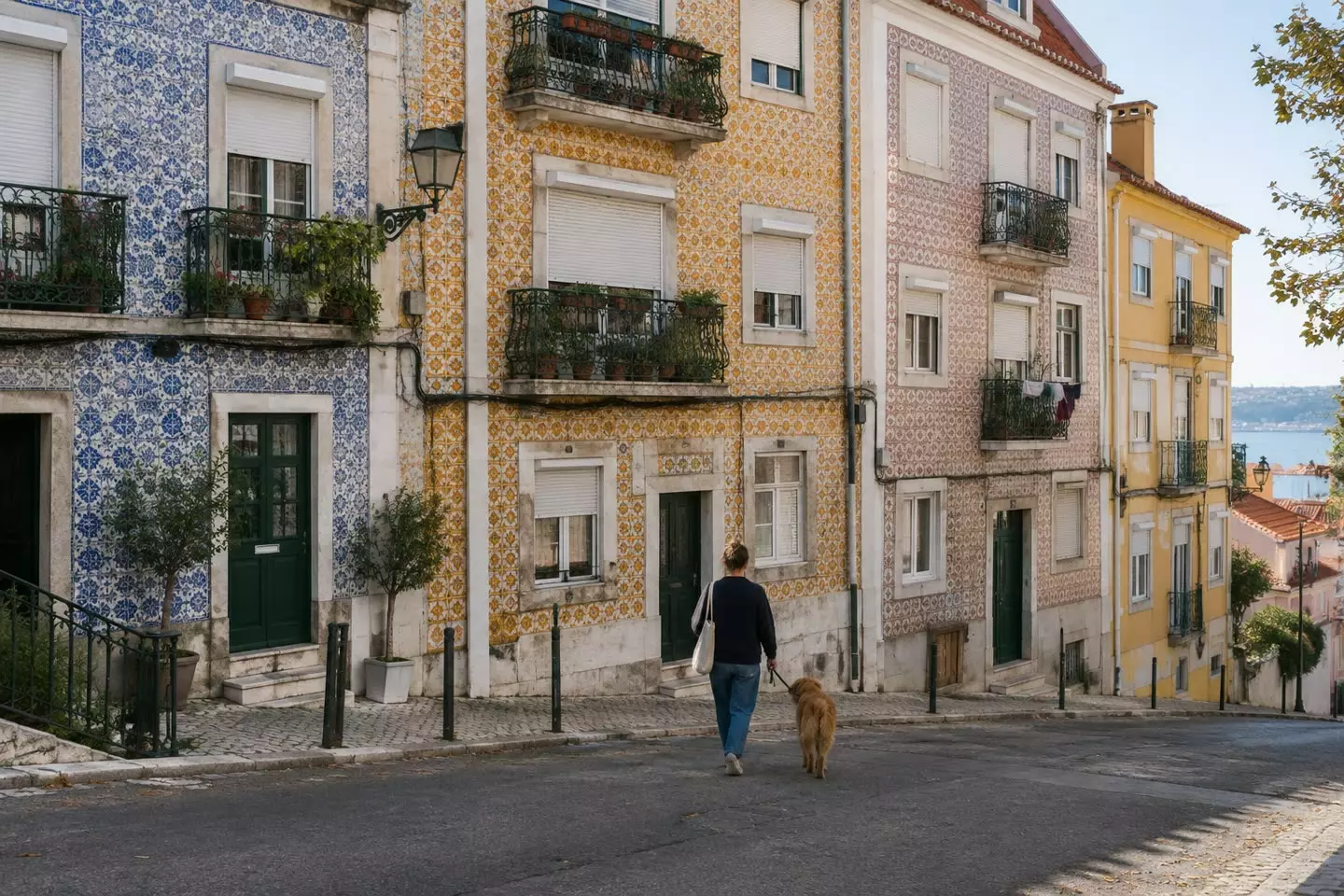 A residential street of tiled facades and iron balconies in Lisbon on a mild autumn morning (illustration)