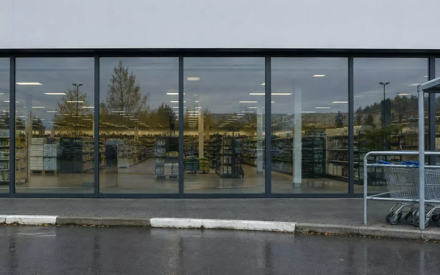 The glazed shopfront and trolley bay of a big-box retail unit on an out-of-town retail park (illustration)