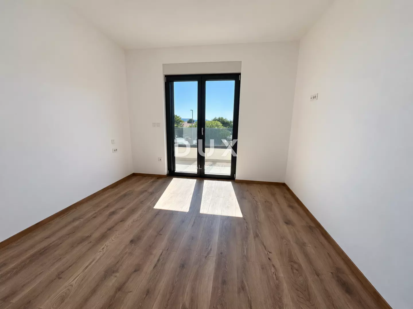 1791192970_bright-minimalist-room-with-glass-balcony-door-00c35b 3-bedroom Apartment In Vodice, Croatia (124,4 M²)