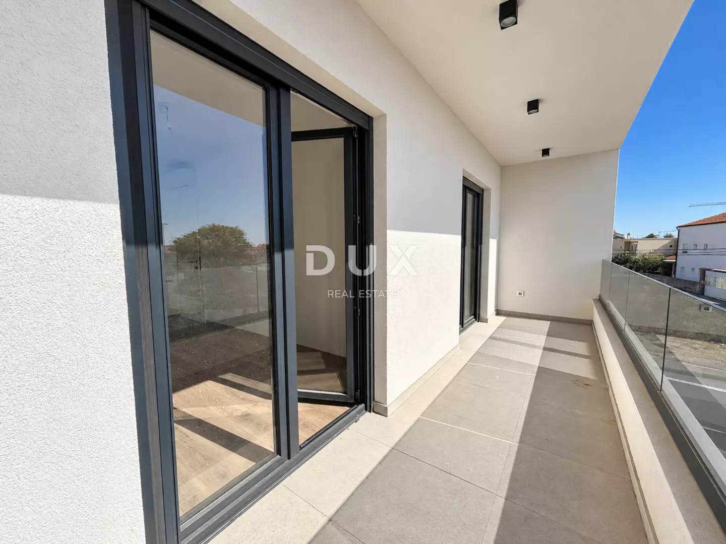 1791193142_sunlit-modern-balcony-with-glass-railing-67df62 3-bedroom Apartment In Vodice, Croatia (124,4 M²)